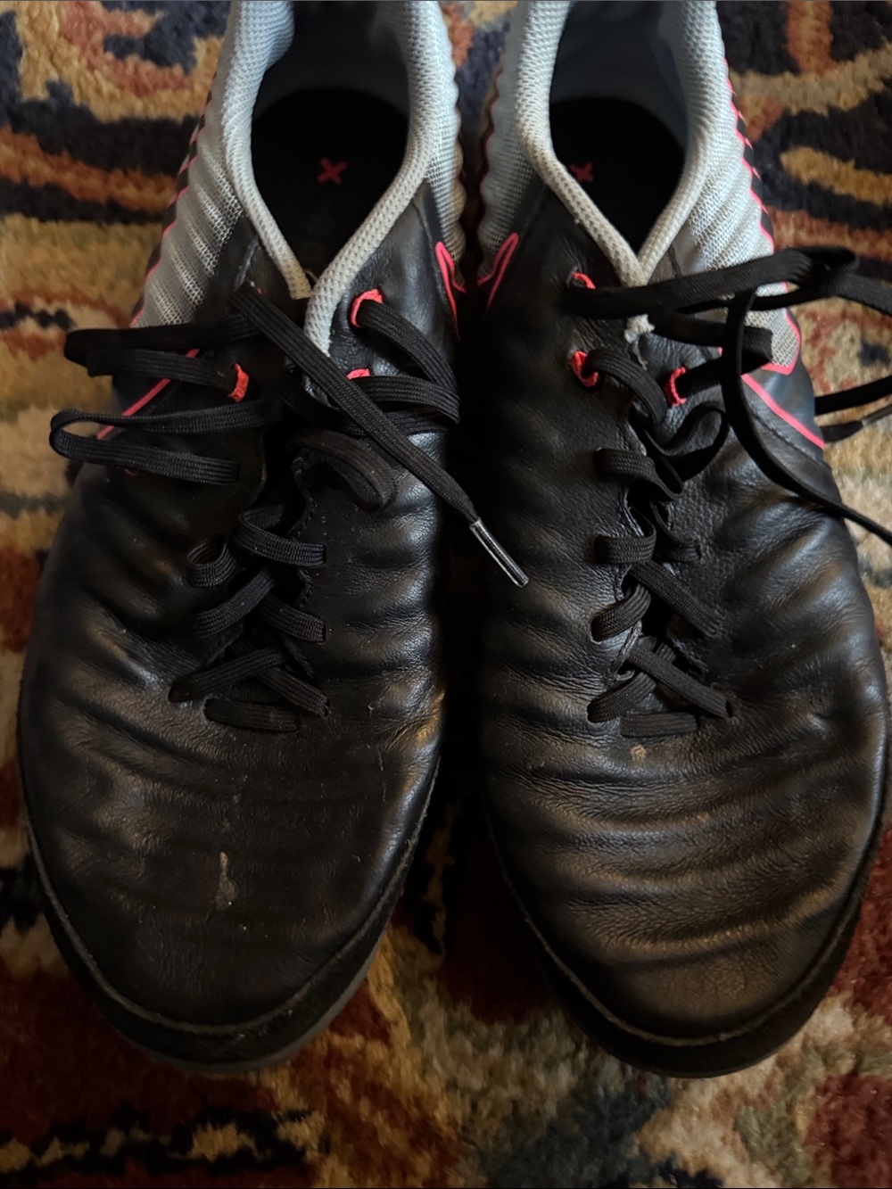 Men's Black Nike Tiempo indoor soccer Athletic Shoes with bright pink Accents